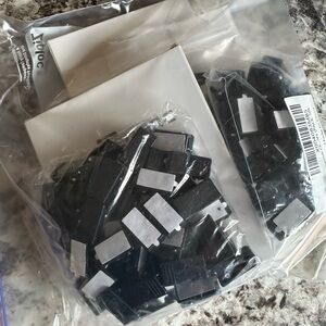 Black Self Adhesive Clips, about 100 clips total